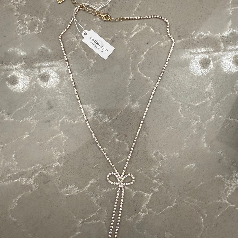 Brand new Park Lane sparkle bow necklace gold